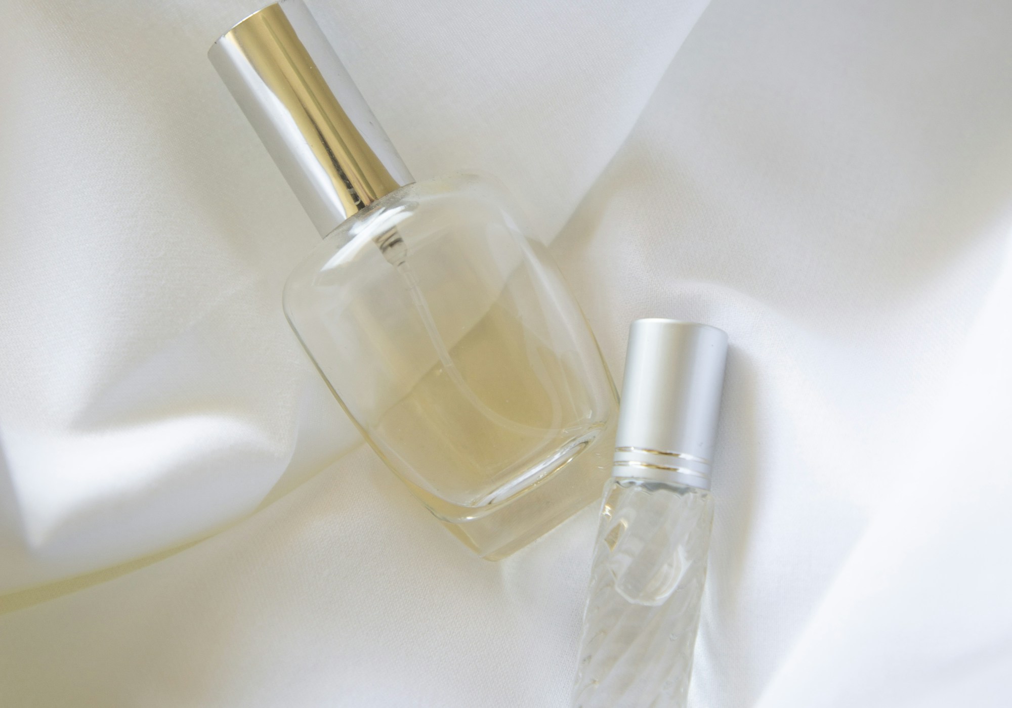 Fragrance bottles on soft fabric